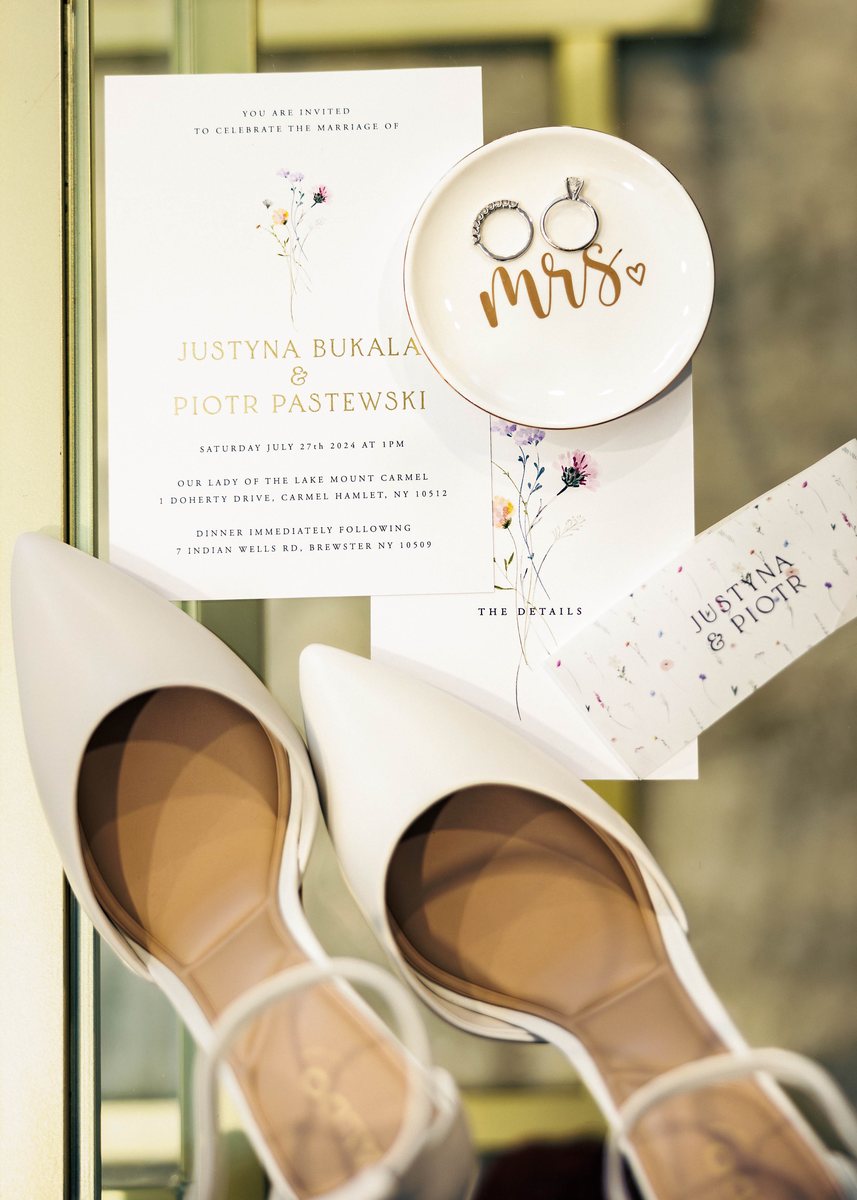 Wildest Dreams wedding invitation, details card and belly band with wildflower names, styled with rings and shoes